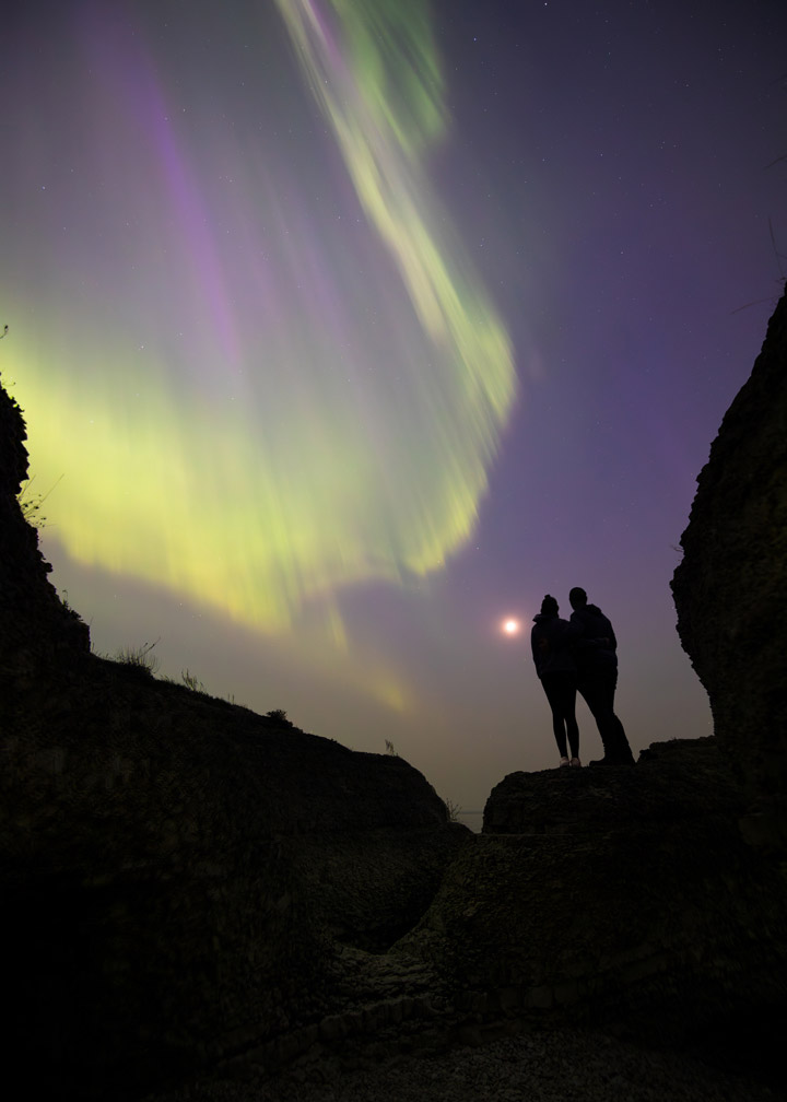 A brilliant display of the aurora borealis lights up the night sky, photographed by a citizen scientist during the May 2024 geomagnetic storm