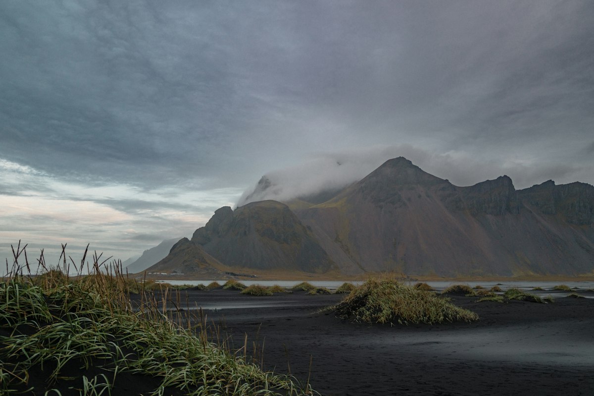 Dramatic mountains under a heavy, moody cloud deck at Stokksnes in southeast Iceland, the kind of sky the Met Office cloud map is designed to predict.